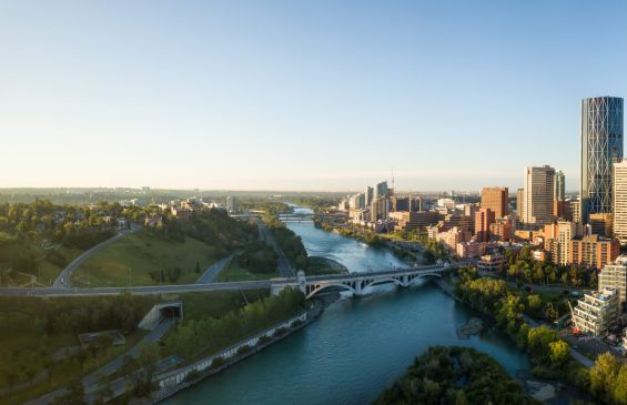 Aerial panoramic view of a beautiful modern cityscape during a vibrant sunny sunrise. Taken in Calgary Downtown, Alberta, Canada.